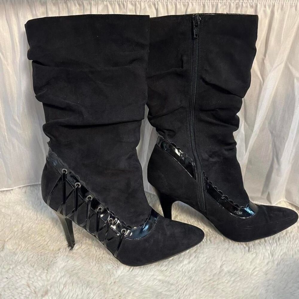 Black faux suede just below the knee-high boots with lace-up detail